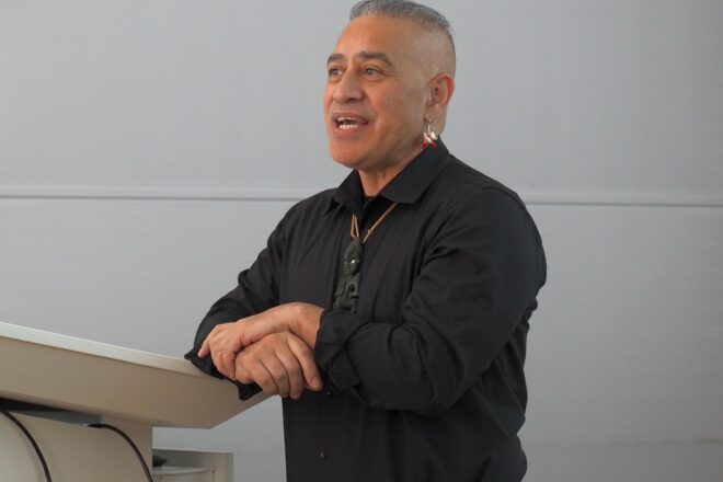 Te Herekiekie Herewini holding a lecture on sensitive provenances